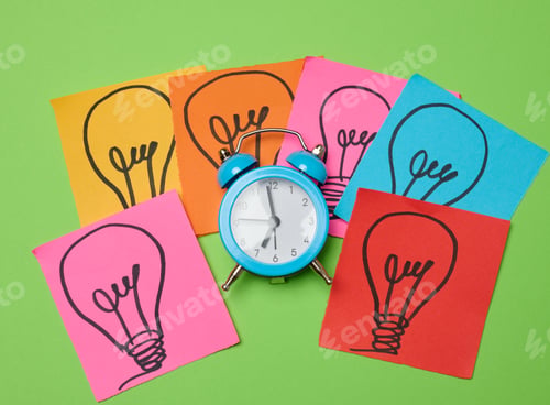 Preview: Drawn electric lightbulbs on paper sheets with a green background