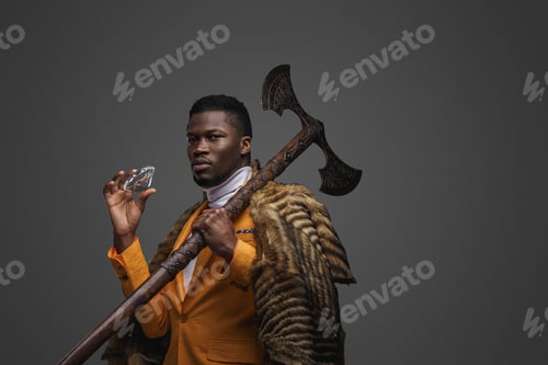 Preview: Dark-skinned man holds massive diamond and axe against a neutral gray background