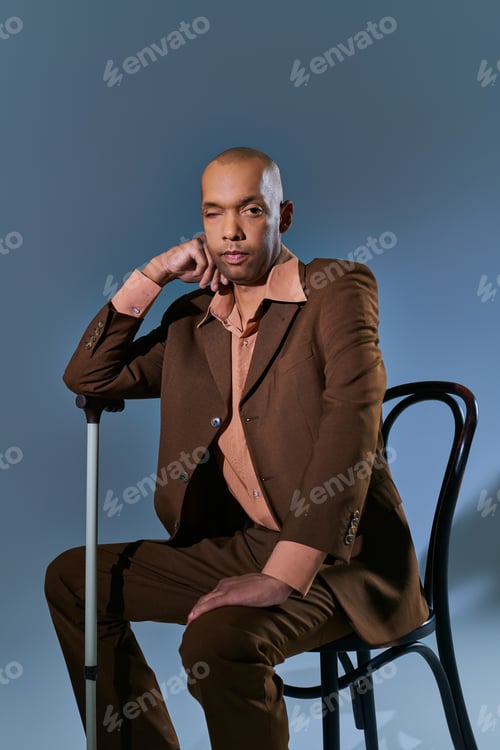 Preview: diversity and inclusion, ptosis, african american man with myasthenia gravis syndrome sitting