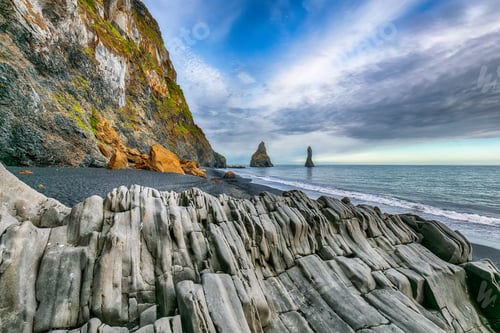 Preview: landscape with basalt rock formations Troll Toes on Black beach Reynisfjara near the village of Vik.