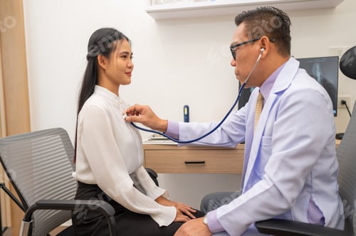 Preview: Doctor using stethoscope to listen heartbeat of elderly patient.