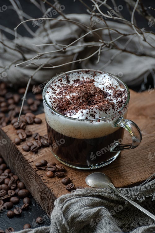 Preview: Coffee americano with milk foam and chocolate on a wooden board