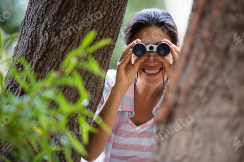 Preview: Woman Hiking Through A Forest In The Countryside