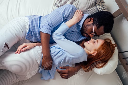 Preview: redhaired ginger caucasian happy female and multi-ethnic afro man together