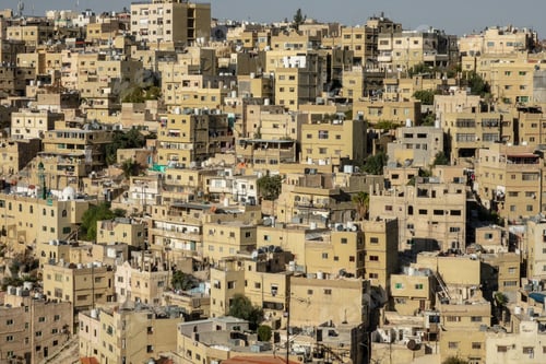 Preview: Light brown buildings of a city constructed in close vicinity to each other