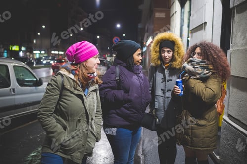 Preview: group of young women standing in the street and having conversation
