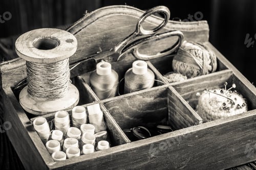 Preview: Vintage threads, needle and scissors on tailor table