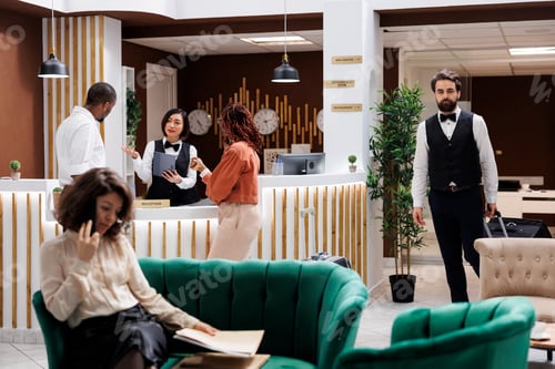 Preview: Asian receptionist welcoming people