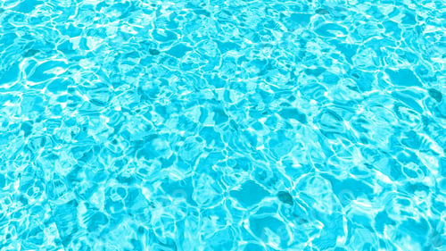Preview: Closeup of desaturated transparent clear calm water surface texture with splashes and bubbles