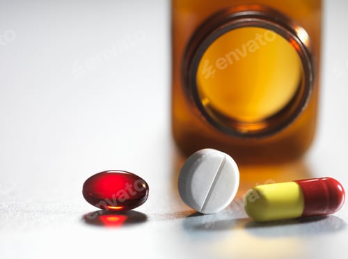 Preview: Pain killers pouring from brown medicine bottle