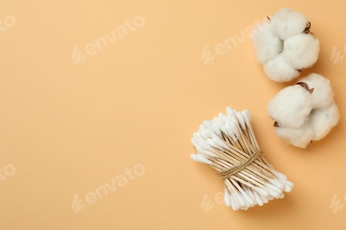 Preview: Cotton swabs and cotton on beige background