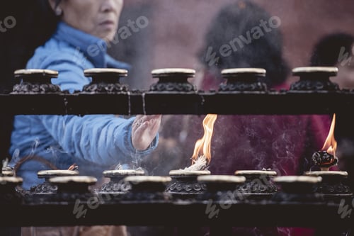Preview: Closeup shot of people burning sage with a blurred background