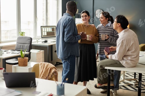 Preview: Multiethnic Group of People Talking at Coffee Break