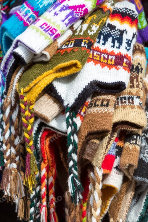 Preview: Group of colored Peruvian snow cap for sale at the Cusco market.