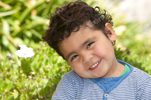 Preview: Cute Hispanic Toddler Boy Smiling Outdoors in Sunlight