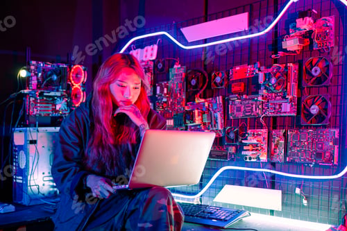 Preview: Asian woman is sitting at a desk with a laptop service in server room, Thinking and solve problems