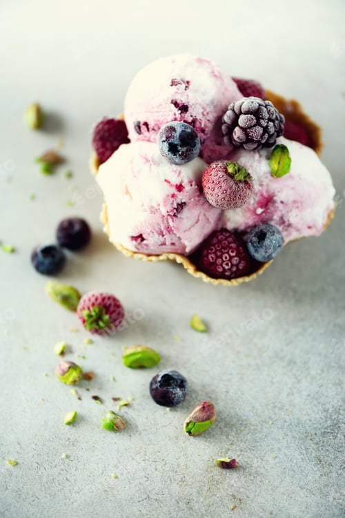 Preview: Pink ice cream with berries, strawberries, blueberries, raspberries, pistachios in waffle basket