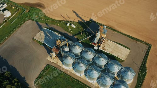 Preview: 4K Aerial Elevated Top View Modern Granary, Grain-drying Complex, Commercial Grain Or Seed Silos In