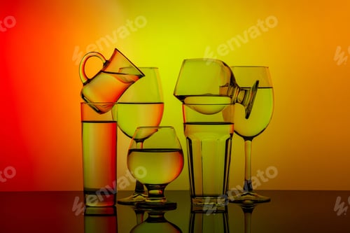 Preview: Glasses for different drinks stacked on a colorful background