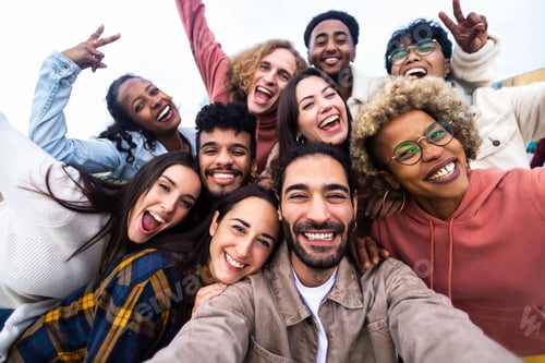 Preview: Big group portrait of diverse young people together outdoors