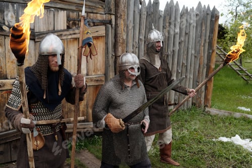 Preview: Preparing for Battle in Medieval War Costumes Holding Torches