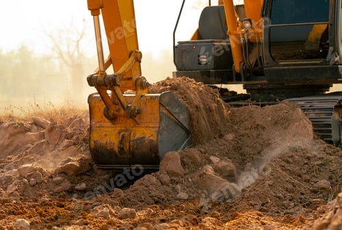 Preview: Backhoe working by digging soil at construction site. Crawler excavator digging on demolition site