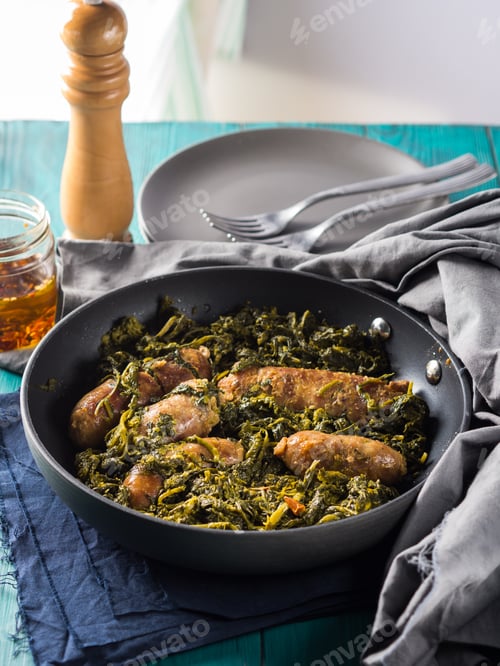 Preview: Italian sausages with rapini broccoli in a skillet