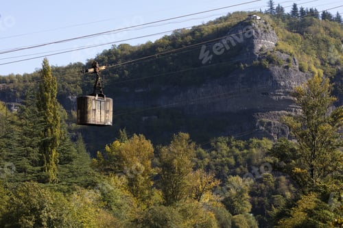 Preview: A rusty cable car hangs over the river in Chiatura, Georgia - Mining Town