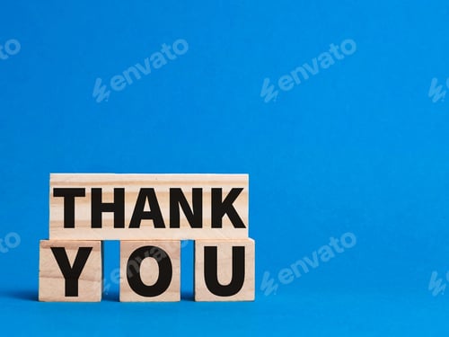 Preview: Words thank you written on wooden blocks isolated on blue background.