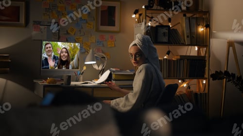 Preview: Evening woman speaking web cam with friends. Joyful couple waving in computer