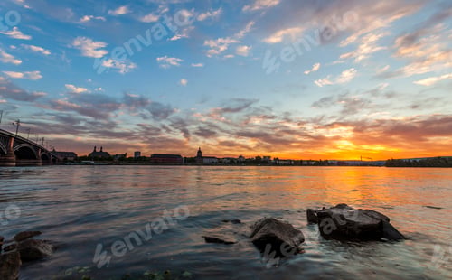 Preview: Beautiful sunset over Rhine / Rhein river and old bridge in Mainz near Frankfurt am Main, Germany.