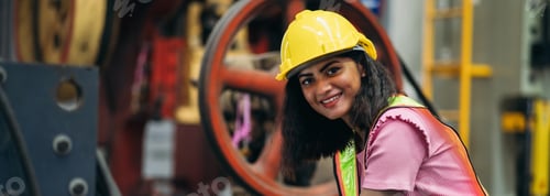 Preview: Portrait of industrial worker inspecting and check up machine at factory machines.