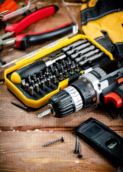 Preview: Working tool. Screwdriver with self-tapping screws on the table.