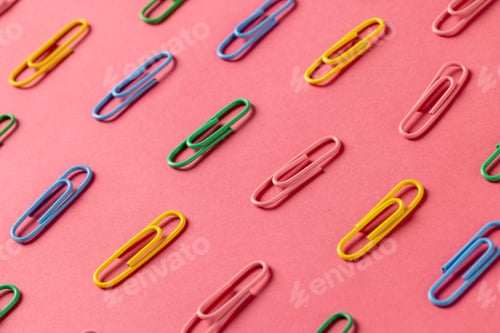 Preview: Composition of colorful clips on pin surface