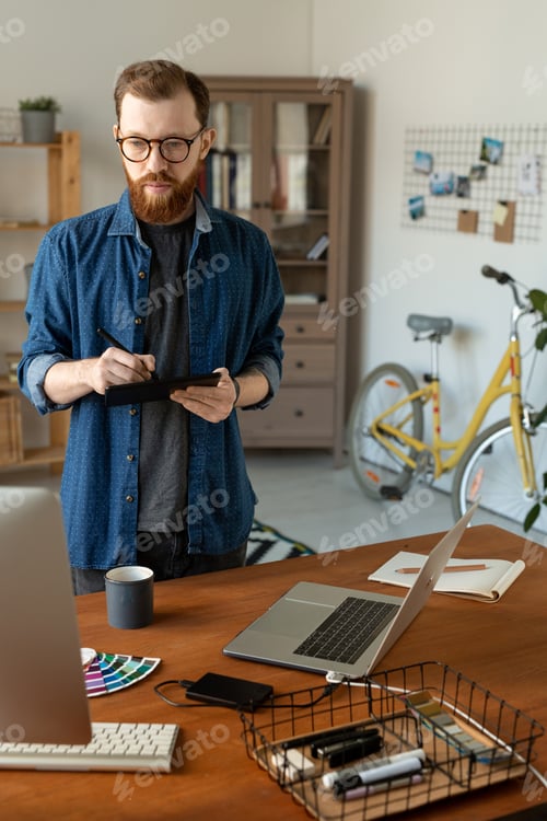 Man Working With Digital Tablet in Home Office