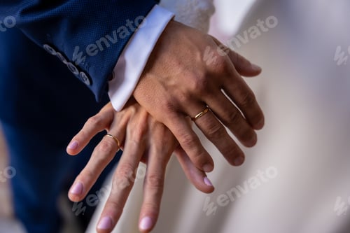 Preview: Hands of bride and groom embraced with rings at a beautiful wedding, marriage ceremony