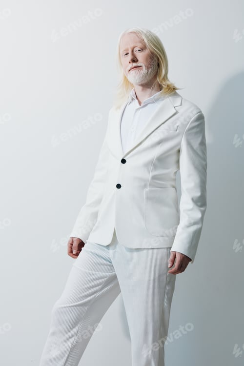 Preview: stylish man in a white suit, minimalistic background, confident expression, modern fashion, elegance