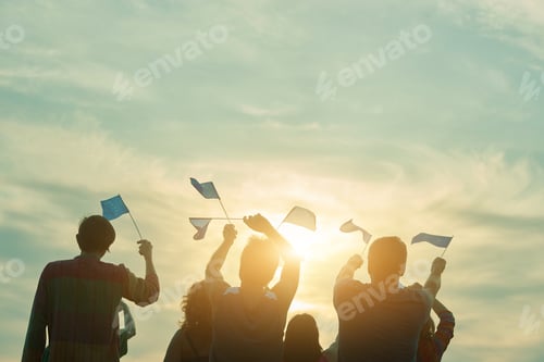 Preview: People raising european union flags in the air.