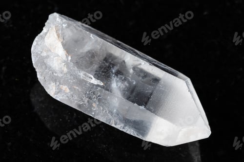Preview: sample of raw rock crystal on black granite