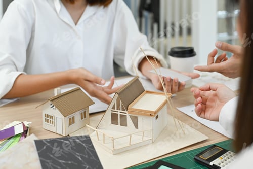 Preview: Professional team of engineers or architects, brainstorming together over joint building project