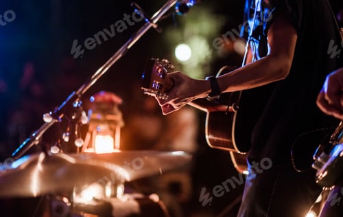 Preview: The musicians were playing rock music on stage, there was an audience