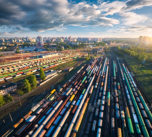 Preview: Drone view of freight trains at sunset. Railway cargo wagons