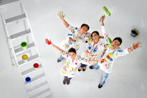 Preview: Happy Group Of Painters Holding Their Brushes And Smiling