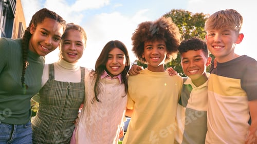 Preview: Portrait Showing Class Of Secondary Or High School Pupils Standing Outside School Building Hugging