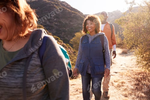 Preview: Group Of Senior Friends Go Hiking Along Trail In Countryside Together