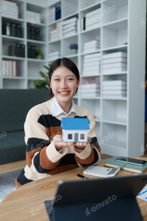 Preview: woman devises a financial saving plan focused on securing a residential loan, carefully managing her