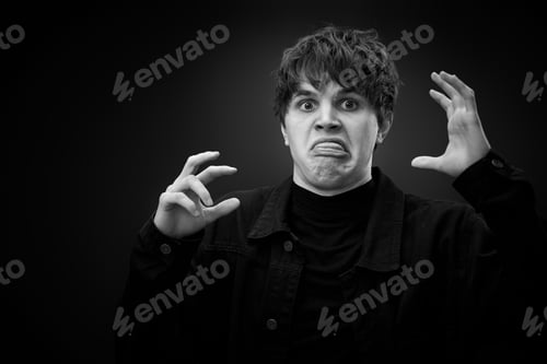 Preview: crazy young man with awesome hairdo grimacing
