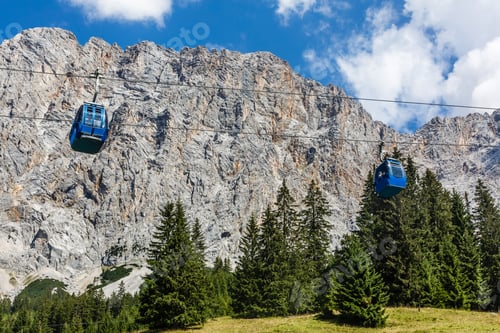 Preview: Ski lift in summer. Cable car. View from the mountain. Beautiful landscape. Ski track in summer