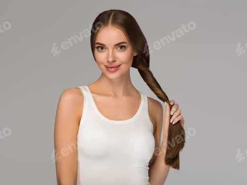 Preview: Woman Poses Holding Braid Against Neutral Background