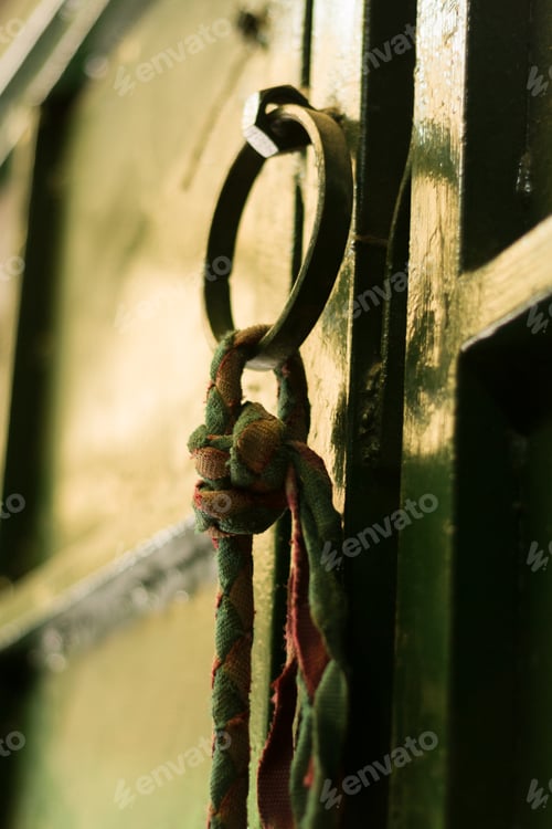 Preview: Old rustic vintage wood door closeup background. Ornamental gate detail traditional